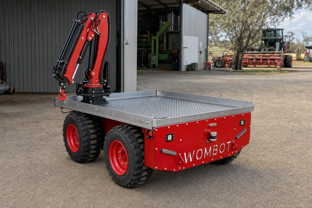 Wombot platform fitted with a compact red crane module