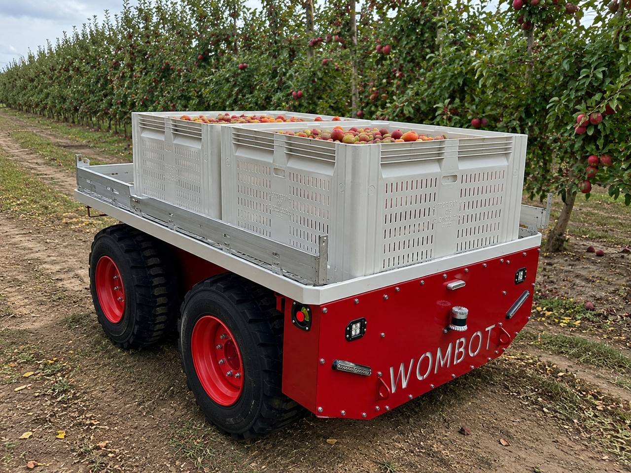 Wombot platform carrying apple bins on its deck