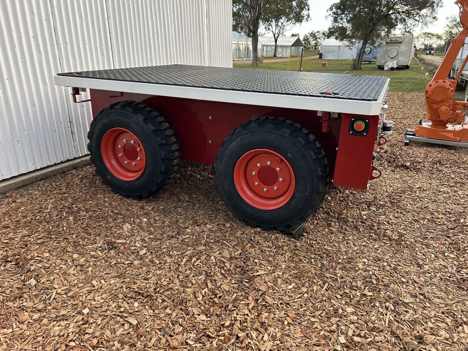 Side view of the Wombot prototype showing the flat deck and large tyres